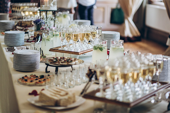 Stylish champagne glasses and food appetizers on table a corporate event