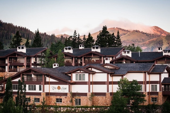 Stein Eriksen Lodge in the mountains surrounded by pine trees