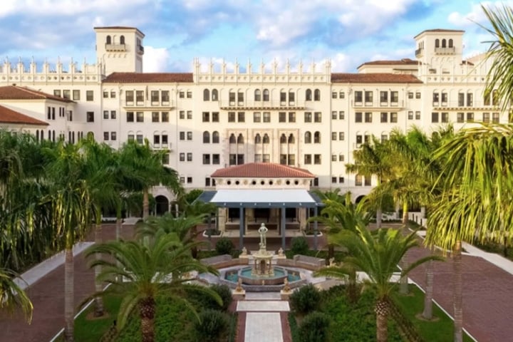 The Boca Raton surrounded by palm trees