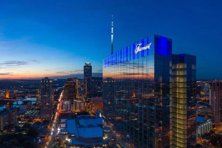 The Fairmont Austin hotel surrounded by tall buildings