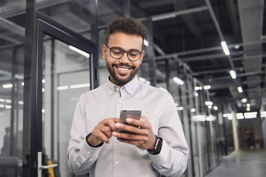 Man professional using smartphone in office.