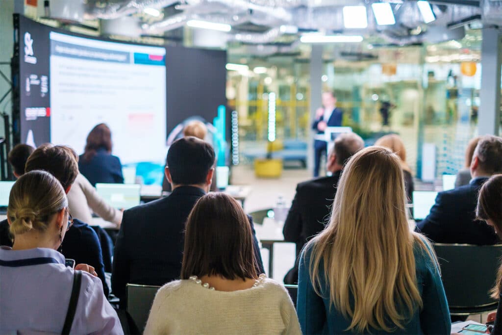 Audience listening to a speaker's presentation