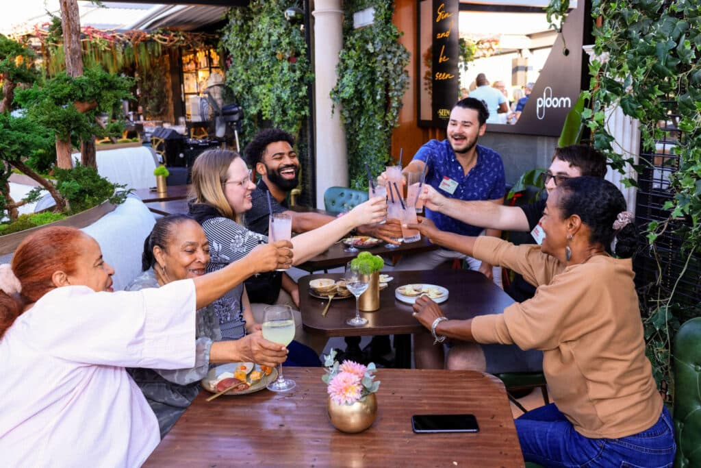 Team toasting with drinks to celebrate